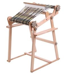 an old fashioned weaving machine on a white background