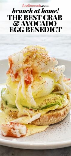 an egg and avocado sandwich on a white plate with the words, brunch at home? the best crab & avocado egg benedict