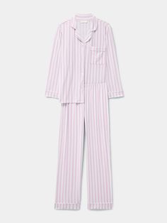 For the most luxurious night’s sleep, the Long Pyjama Set in Pale Pink Stripe print is the ultimate choice. Elevating every night-time ritual, slow Sunday morning and indulgent lazy day, this is comfort like no other. Made from 95% biodegradable TENCEL™ Modal x Micro (AKA trees!). Proven to be more than twice as soft as cotton. Cloud-soft, breathable, feminine & comfortable. Sustainable nightwear designed by women, for women. One tree planted with every order. Model wears a size M. Mainline - 95% TENCEL™ Modal, 5% Elastane. Lace: 91% Nylon, 9% Elastane. B-Edit - 74% TENCEL™ Modal, 19% SeaCell™ and 10% Roica V550. Soft Brushed Woven - 100% EcoVero Viscose from Lenzing. We recommend washing on a cool, 30 degree wash or by hand. Dry flat and avoid tumble drying. Pink Striped Pajamas, Jess Outfits, Chilling Outfits, Pink Pyjamas, Thrift Wishlist, Lulu Outfits, Striped Pajamas, Slow Sunday, Bday Wishlist