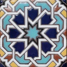 an ornate tile design with blue, yellow and orange colors on the bottom half of it