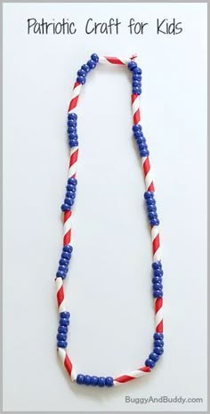 a red, white and blue beaded necklace on a string