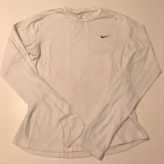 Nike White Dri-Fit Long Sleeve. Nwot- It Has Never Been Work, But I Have Washed It By Mistake. The Plastic Portion Of The Tag Is Still Attached, But The Tag Itself Did Not Make It Through The Laundry. It's The Softest Nike Shirt I've Purchased, Just Unfortunately Doesn't Fit. It Is A Slimmer Cut. (Sorry For The Wrinkles, It Has Been Stored In Closet And That Kind Of Fabric) Girl Wishlist, Nike Long Sleeve Shirt, Tops Nike, Athletic Clothes, Nike Long Sleeve, Nike Shirt, White Long Sleeve Shirt, Nike Tshirt, Nike White