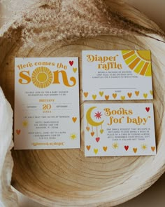 three wedding cards on top of a wooden bowl