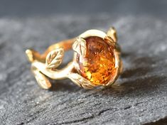 Gold Amber Ring set with a Natural Amber in the highest quality & brownish-yellow translucent resin, at 10x8mm, 3 Carats, sourced from Russia. Gold Leaf Ring made of Gold Vermeil ☞ thickest 18k Gold Plating on top of Solid 925 Sterling Silver ☞ made to last. Matching Earrings & Matching Pendant - please ask me ☞ Choose your size ☞ I resize (before shipping) for FREE to Any size* ⌛Last Ring left ⌛ ❀ Each Natural Gem is unique & will have Slight variations from the product pictures "no two Natural Unique Yellow Gold Crystal Ring, Luxury Nature-inspired Recycled Gold Rings, Luxury Nature-inspired Rings In Recycled Gold, Earthy Rings By Angeline, Amber Engagement Ring, Proposal Ring Gold, Imperial Topaz Ring, Gold Leaf Ring, White Gold Promise Ring