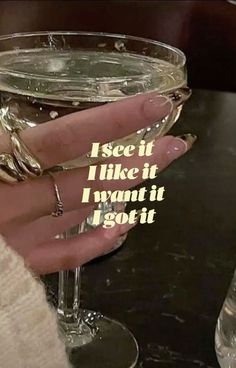 someone holding a wine glass with the words i see it like it, i want it i got it