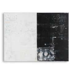 two black and white paintings on a white wall