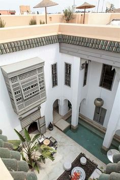 an aerial view of a courtyard with potted plants