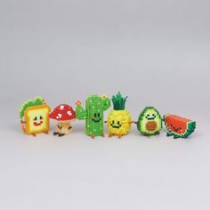 a group of pixelated fruit and vegetable figurines sitting next to each other