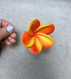 "Small hairpin in plumeria, the plumeria is soft to the touch, made of real touch foam, it is fake flower. The Hair Bobby Pins used are small in gold color. The price is for one hairpin. SIZE: Plumeria : 3\" Hair Bobby pin: 2.2\" Full high size: 4.6\".  📸If there are no photos available yet of the product you have ordered, before sending your order we will send you some photos so you can see how it looks. 🚚📦If you need your order to be shipped sooner than estimated by the store, write to us o Luau Wedding, Hawaii Flowers, Tropical Orange, Tropical Wedding Flowers, Floral Accessories Hair, Real Touch Flowers, Flower Hair Accessories, Wedding Hair Pins, Bridal Hair Pins