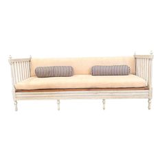 a white wooden couch with two pillows on it's back and sides, against a white background