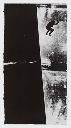 a black and white photo of a skateboarder in mid air