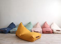 a group of bean bags sitting on top of a wooden floor