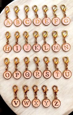 the alphabet keychains are all in different colors and sizes, with letters on them