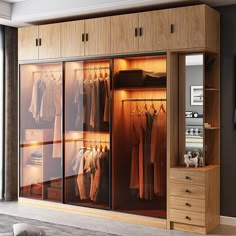 an open closet with clothes on hangers and drawers