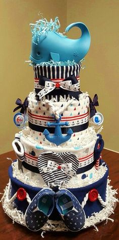 a multi layer cake with blue shoes on top