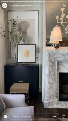 a living room filled with furniture and a fire place in front of a painting on the wall