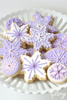 purple and white decorated cookies on a plate