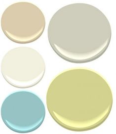 four different colors of paint on the same wall and one is white, yellow, blue, and green