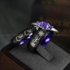 THIS LISTING IS FOR THREE (3) RINGS:  HER BAND: 6MM BLACK TUNGSTEN BAND = MOON  HER RING: 3MM .925 STERLING SILVER THREE STONE BAND PRONG SETTING (2 X AMETHYST DIAMOND CZ (3MM) & AMETHYST DIAMOND CZ (5MM)) AVERAGE WEIGHT: 4.8GMS QUALITY: AAAAA  HIS BAND: 8MM BLACK TUNGSTEN BAND = SUN  Need a custom size / design? contact us and we’ll make it for you.  Please get professionally measured for ring size and read our exchange policy carefully prior to ordering. Sun And Moon Wedding, Sun And Moon Jewelry, Moon Rings, Rings Matching, Jewelry Couple, Matching Couple Rings, Sun And Moon Rings, Moon Wedding, Matching Wedding Rings