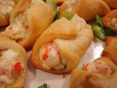 small appetizers are arranged on a plate with toothpicks and green peppers