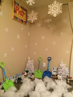 a room with toys and snow flakes on the floor