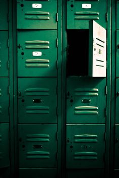 a row of lockers with one open door and the other closed