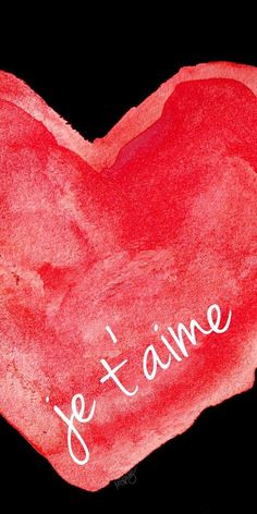 a red heart with the words je t aime written on it in white ink