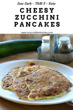 low carb, thm - free cheesy zucchini pancakes on a white plate