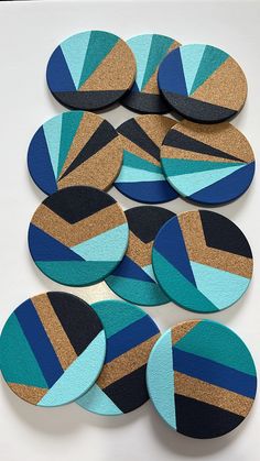 several circular coasters with blue and brown designs on them