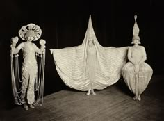 an old photo of two women dressed in costume