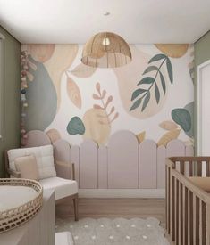 a baby's room with a crib, chair and wall mural in pastel colors