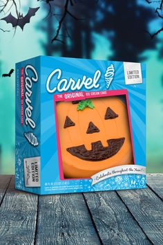 a halloween cookie in a box on a wooden table