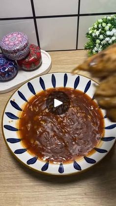 a plate full of food sitting on top of a table next to other plates and vases