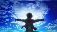 a person standing in the air with their arms spread out and hands outstretched to the sky