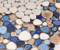 blue and white mosaic tiles with circles on them