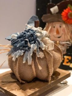 a burlocked pumpkin sitting on top of a wooden board