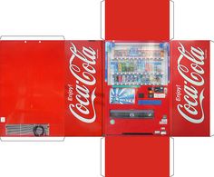 a coca - cola vending machine is cut out and displayed