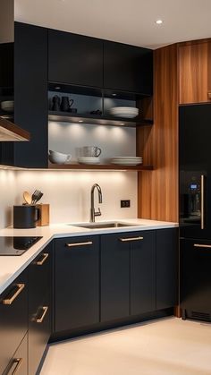 a kitchen with black cabinets and white counter tops