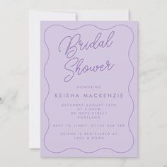 the purple bridal shower card is displayed on a white surface with a marble background