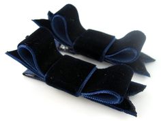 two black and blue bows on a white background