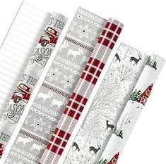 four rolls of christmas wrapping paper on top of each other in various patterns and designs