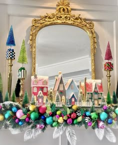 a decorated mantle with christmas decorations and a mirror in the middle, on which is an ornament