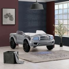 a futuristic car is parked in the living room