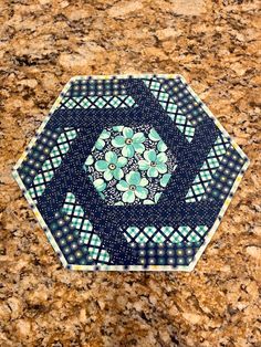 a close up of a blue and green pattern on a marble surface