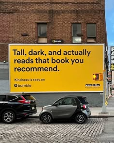 two cars parked next to each other in front of a yellow sign that says, tall, dark, and actually reads that book you recommend