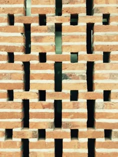 some bricks are stacked together to form a pattern on the side of a brick wall