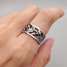 Embrace the timeless beauty of nature with our Oak Leaf and Acorn Band Ring Sterling Silver. Handcrafted with sterling silver and designed in an oxidized style, these rings capture the essence of the wild forest and the bounty of nature. Each ring features intricate oak leaves and acorns, symbolizing strength, growth, and prosperity. The statement band ring offers a bold and stylish look. Celebrate your love with the beauty of the natural world with our Oak Leaf and Acorn Band Ring Sterling Silv Ring For Couple, Oak Leaves And Acorns, Nature Inspired Wedding, Promise Rings For Couples, Wild Forest, Oak Leaves, Oak Leaf, The Natural World, Ring Sterling Silver