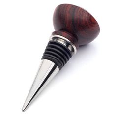 a wine bottle stopper with a metal tip and wood grain design on the top