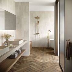 a bathroom with wood flooring and white walls