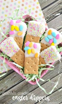 cracker easter dippers in a pink basket on a table with polka dot paper